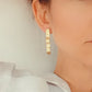 Boucles d'oreilles ondulées en Plaqué Or, motif dentelle