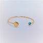 Bracelet Jonc ouvert en Plaqué Or avec Zircone bleu. Pièce unique